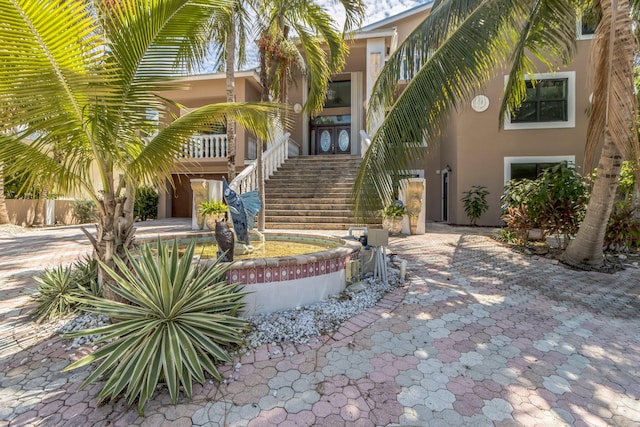 view of home's community featuring stairs