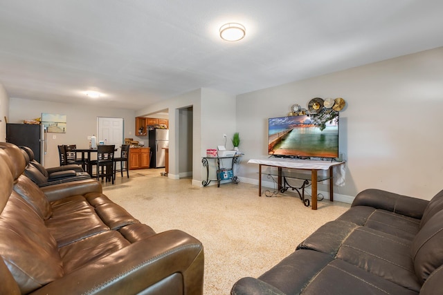 living area with light speckled floor and baseboards