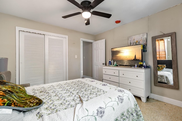 bedroom with ceiling fan, baseboards, and a closet