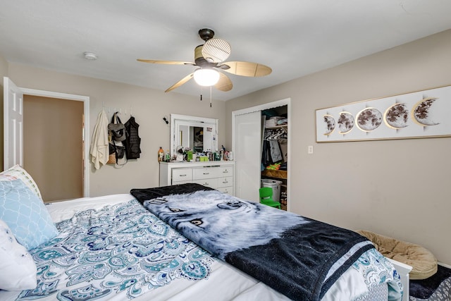 bedroom featuring ceiling fan and a closet