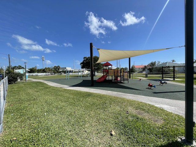 community playground featuring a lawn