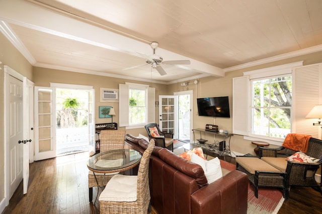 living room with a healthy amount of sunlight, dark wood-style flooring, and a wall mounted air conditioner