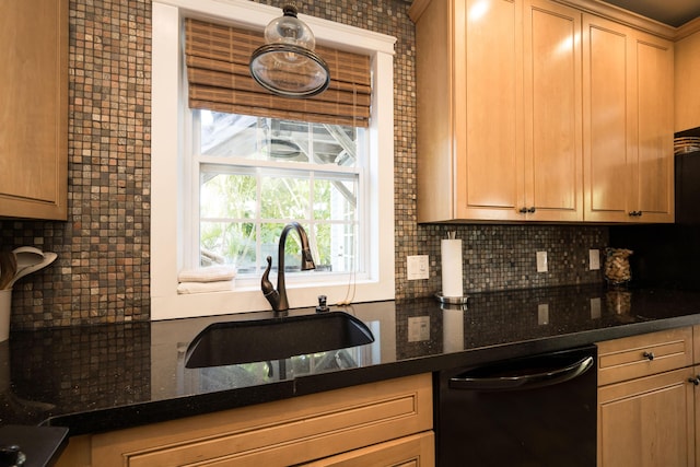 kitchen featuring black dishwasher, dark stone counters, decorative backsplash, and a sink