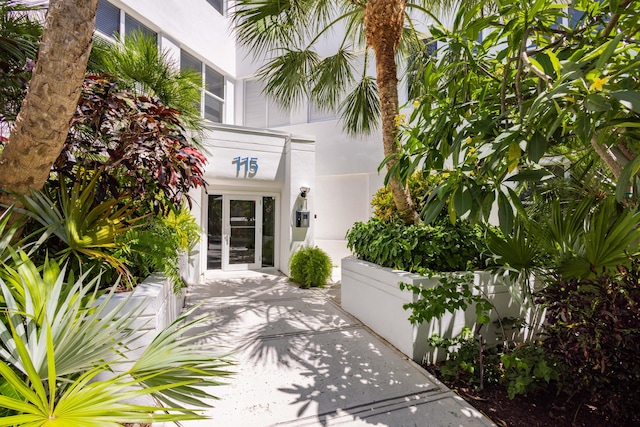 115 Front St Unit 102, Key West, FL 33040 - view of exterior entry featuring stucco siding