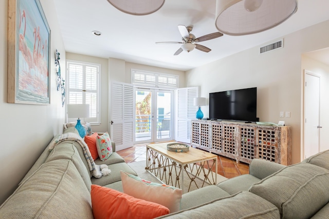 115 Front St Unit 102, Key West, FL 33040 - tiled living room with a ceiling fan