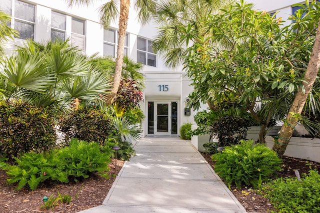 115 Front St Unit 102, Key West, FL 33040 - view of exterior entry with stucco siding