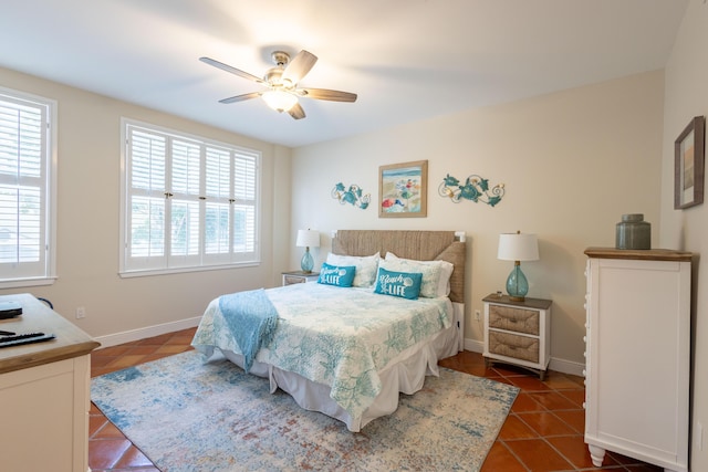 115 Front St Unit 102, Key West, FL 33040 - bedroom featuring dark tile patterned floors and ceiling fan