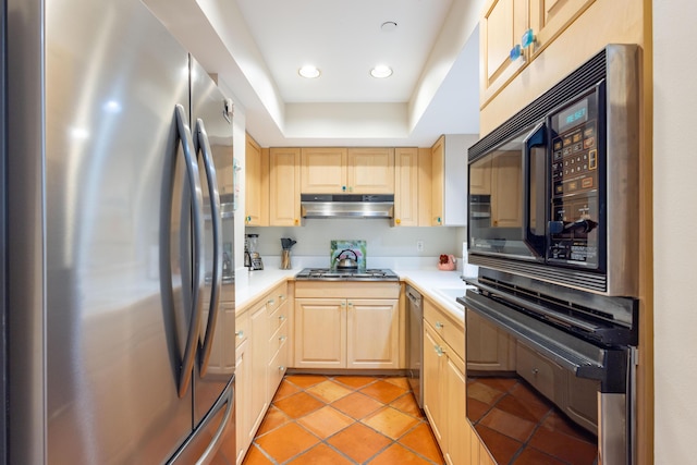 115 Front St Unit 102, Key West, FL 33040 - kitchen with freestanding refrigerator, light brown cabinets, light countertops, double oven, and recessed lighting