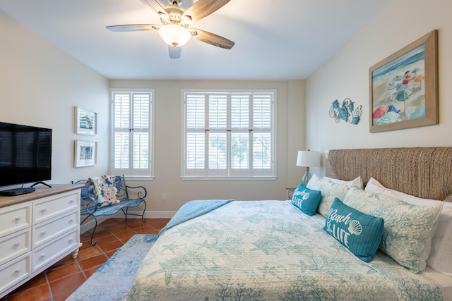 115 Front St Unit 102, Key West, FL 33040 - bedroom featuring dark tile patterned flooring and ceiling fan