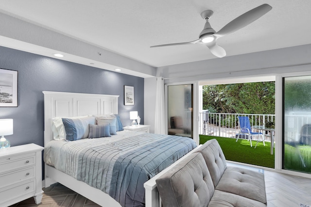 bedroom featuring access to exterior, a textured ceiling, light parquet floors, and ceiling fan