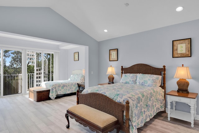 bedroom with lofted ceiling, access to outside, and light hardwood / wood-style floors