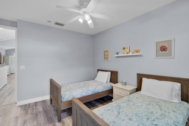 bedroom featuring ceiling fan and light wood-type flooring