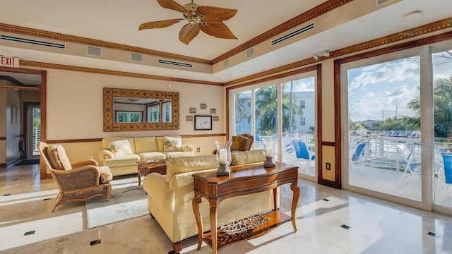 sunroom / solarium featuring ceiling fan