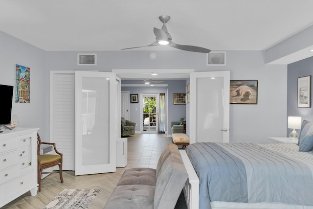 bedroom with ceiling fan and light parquet flooring