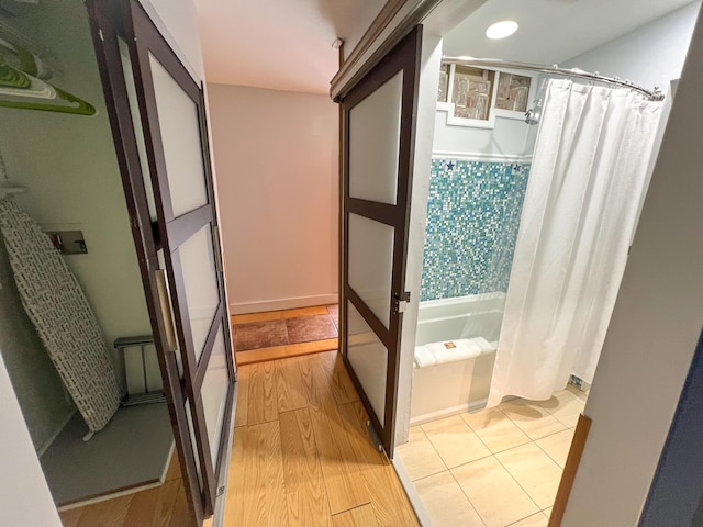 846 Olivia St, Key West, FL 33040 - full bath featuring a bath, a shower with shower curtain, and wood finished floors
