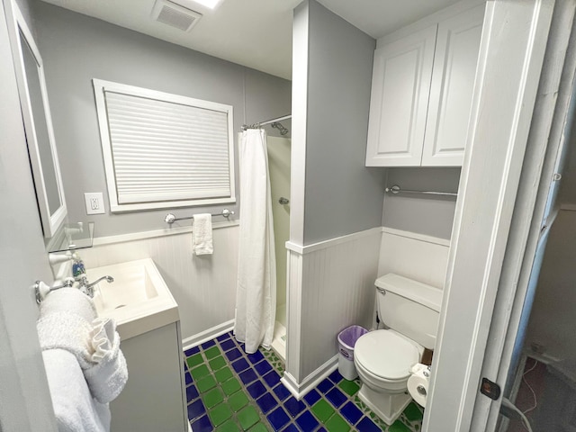 846 Olivia St, Key West, FL 33040 - full bathroom with toilet, a wainscoted wall, vanity, and a shower stall