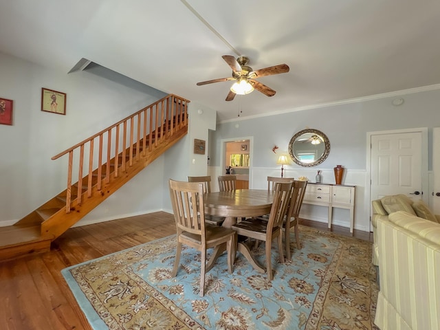 846 Olivia St, Key West, FL 33040 - dining room featuring stairs, a ceiling fan, wood finished floors, baseboards, and crown molding