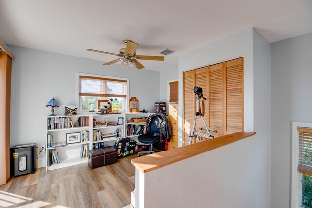 home office featuring ceiling fan and light wood-type flooring