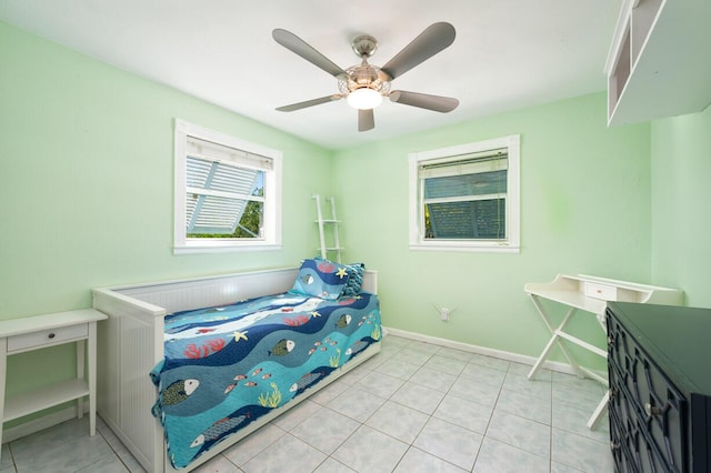 tiled bedroom featuring ceiling fan