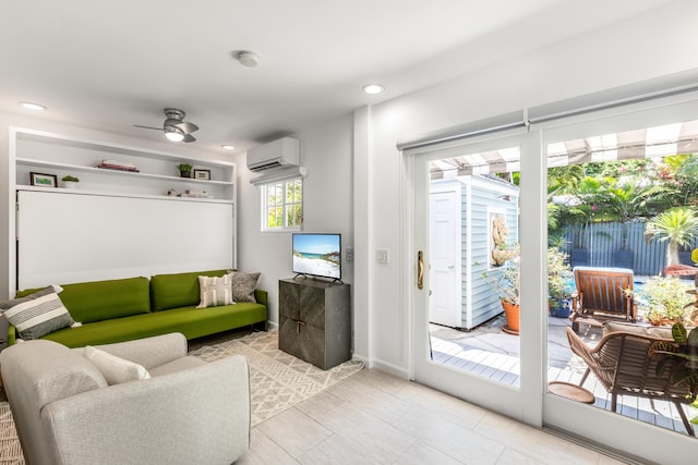 living area with a wall unit AC, a ceiling fan, and recessed lighting