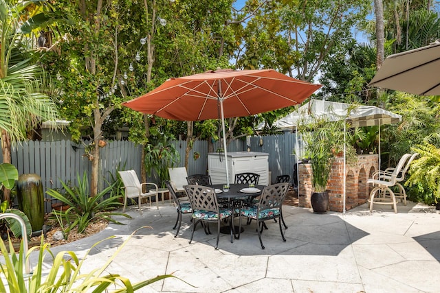 view of patio / terrace featuring outdoor dining area and a fenced backyard