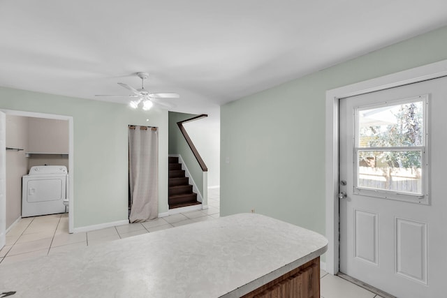 3212 Harriet Ave, Key West, FL 33040 - interior space featuring independent washer and dryer, a ceiling fan, light tile patterned floors, baseboards, and stairs