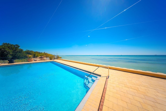 1616 Atlantic Blvd Unit 6, Key West, FL 33040 - view of swimming pool featuring a patio, a water view, a fenced in pool, and fence