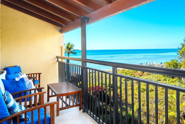 balcony featuring a water view