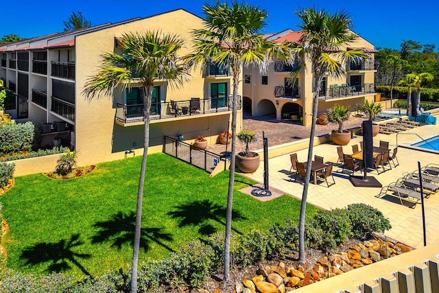 1616 Atlantic Blvd Unit 6, Key West, FL 33040 - exterior space with a lawn, fence, and a patio