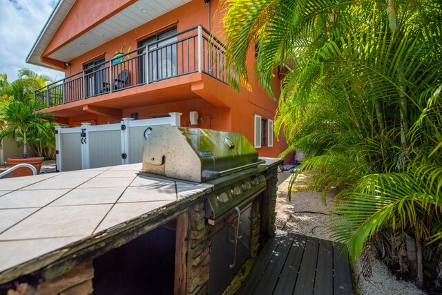 view of home's exterior with a balcony