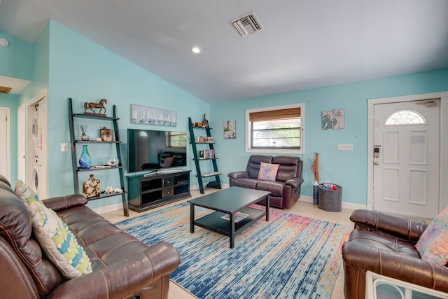 living room featuring vaulted ceiling