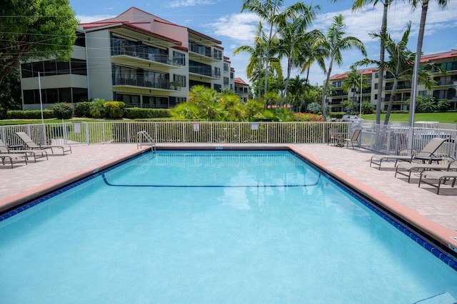 view of swimming pool featuring a patio area