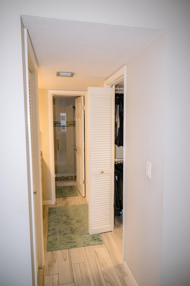 corridor featuring light hardwood / wood-style flooring