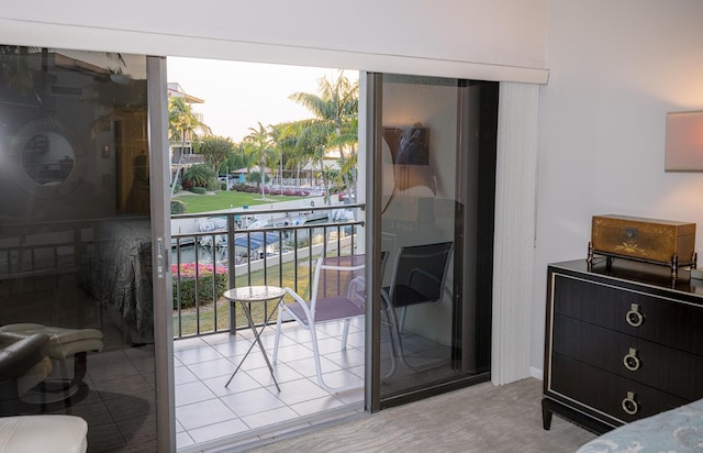 doorway to outside with light carpet