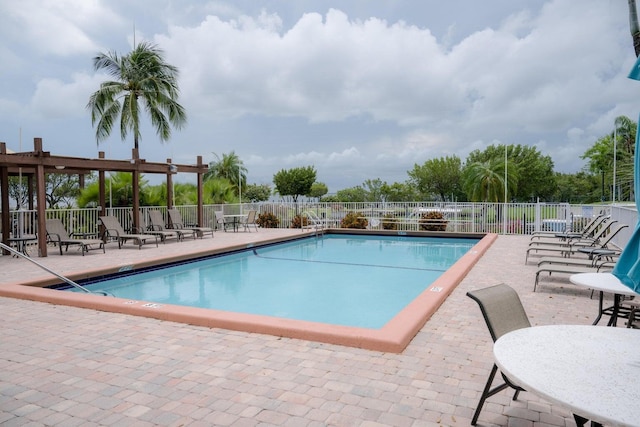 view of swimming pool with a patio area