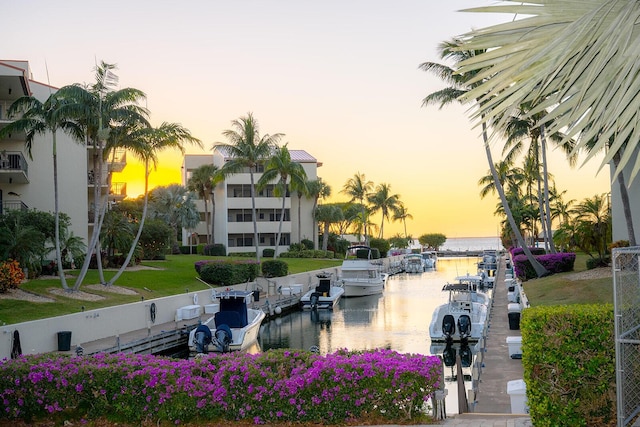 exterior space with a water view and a dock