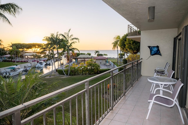 balcony at dusk with a water view