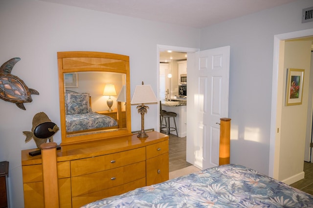 bedroom featuring dark wood-type flooring