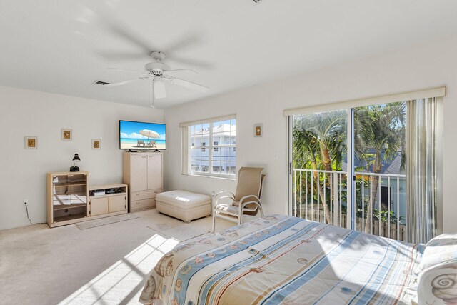 bedroom with light carpet, access to outside, and ceiling fan