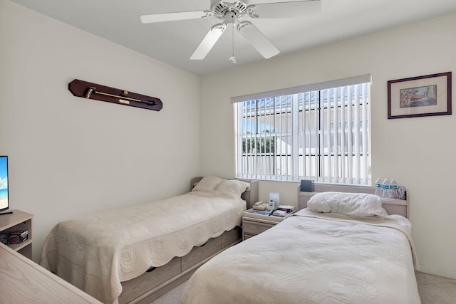 bedroom with ceiling fan and carpet