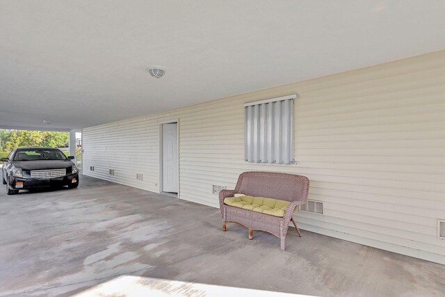 view of patio / terrace featuring a carport