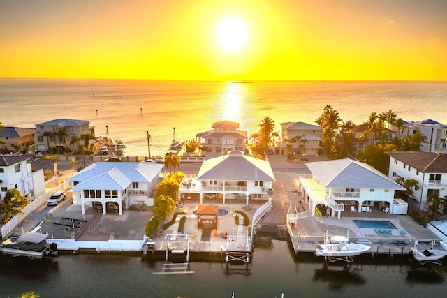 aerial view at dusk with a water view