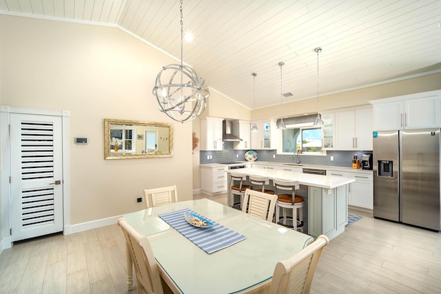 dining room with sink, crown molding, a chandelier, wooden ceiling, and light wood-type flooring