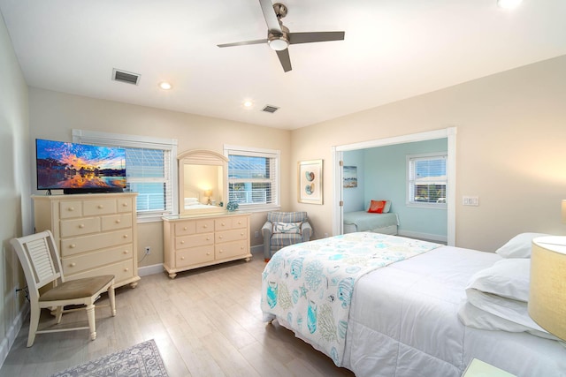 bedroom with ceiling fan and light wood-type flooring