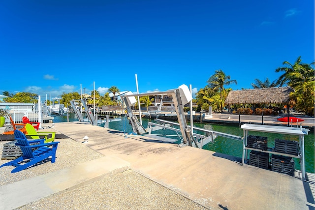 exterior space featuring a dock and a water view