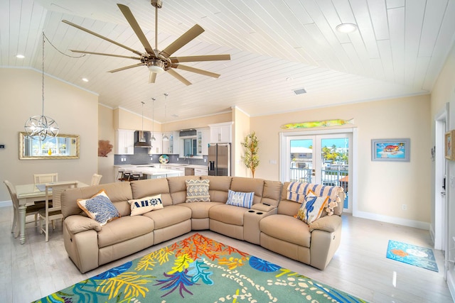 living room featuring vaulted ceiling, crown molding, and wood ceiling