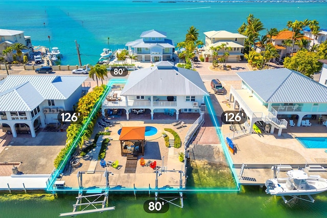 943 Flagship Dr, Summerland, FL 33042 - drone / aerial view featuring a water view