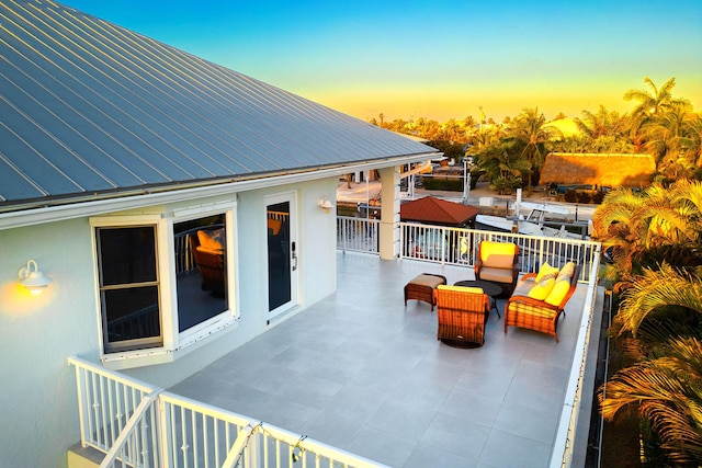 view of patio terrace at dusk