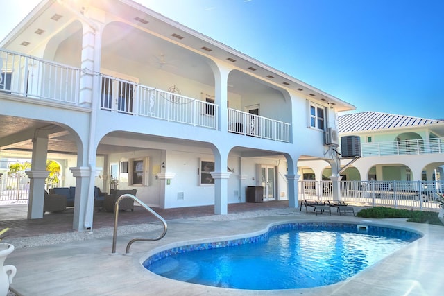 943 Flagship Dr, Summerland, FL 33042 - rear view of house with a patio, fence, stucco siding, and a fenced in pool