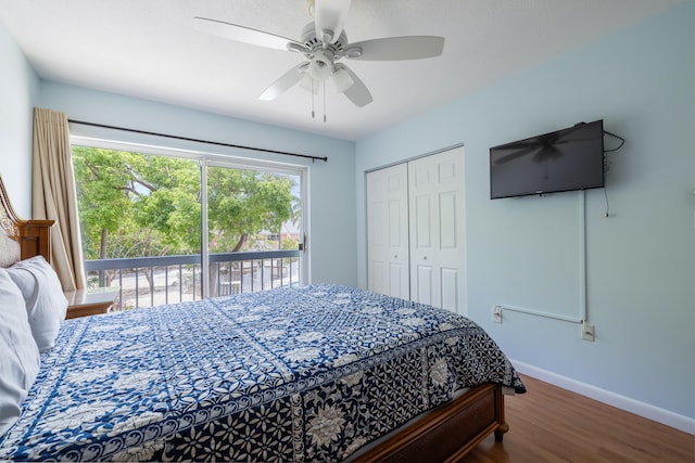 bedroom with ceiling fan, dark hardwood / wood-style flooring, a closet, and access to outside